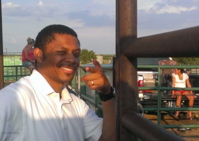 NSM medic smiling at an outdoor rodeo event