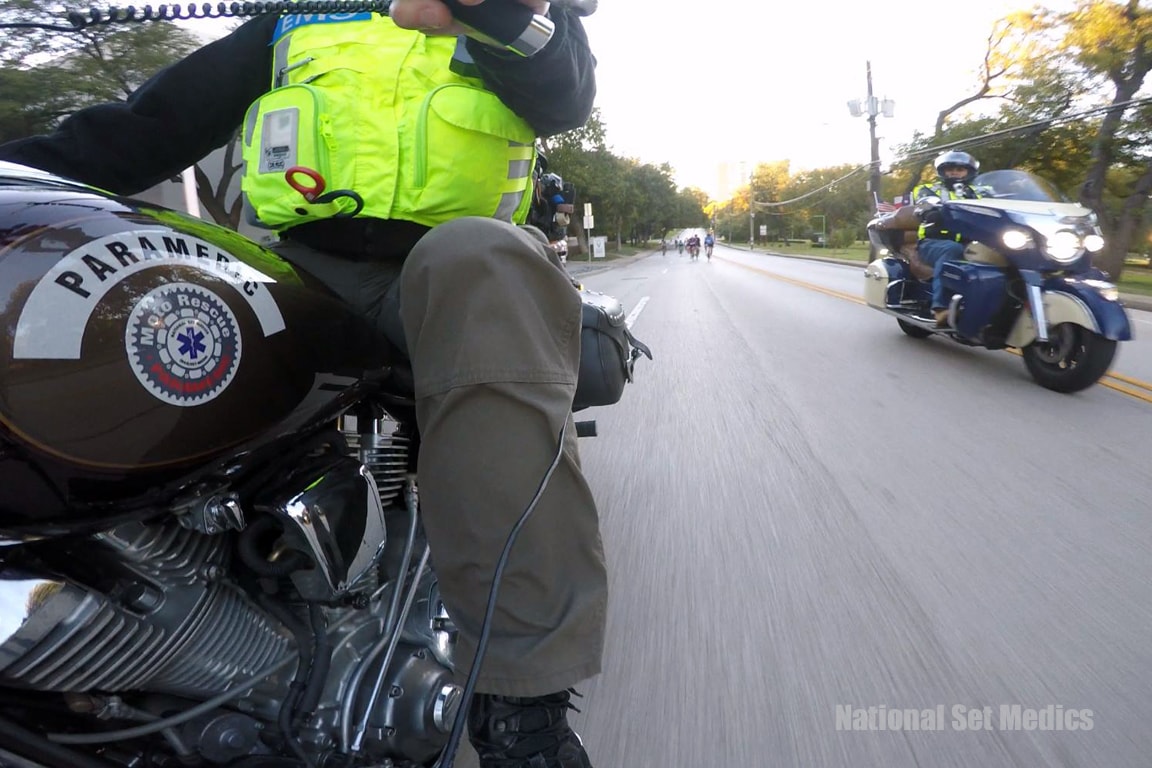 Paramedic riding motorcycle at event